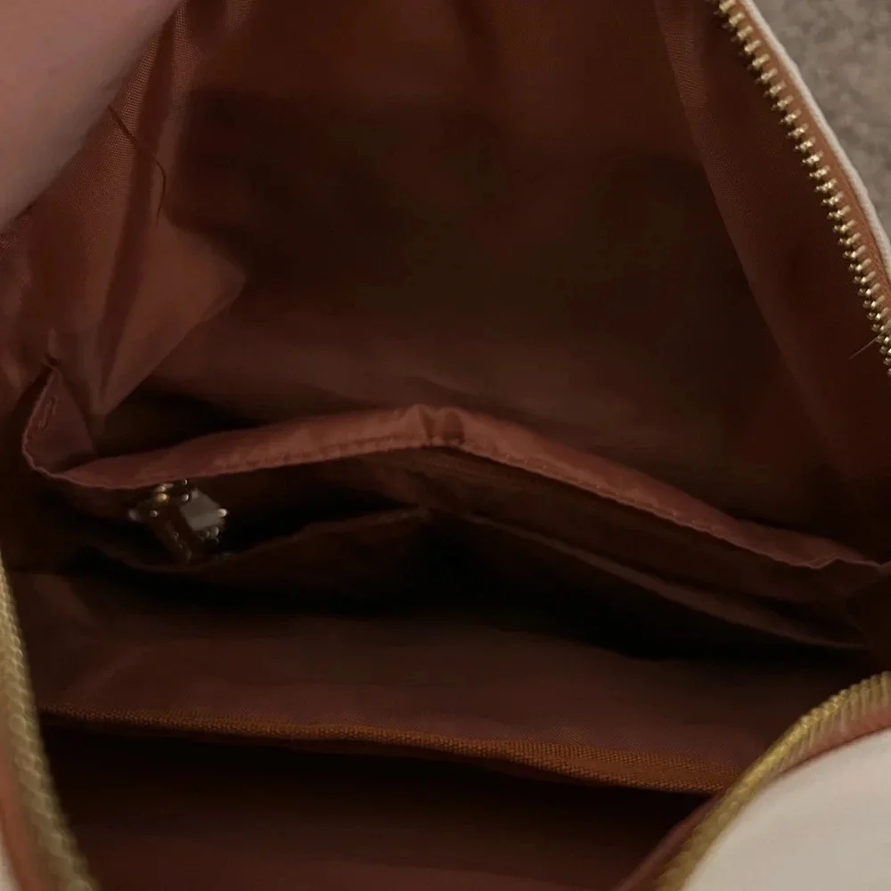 White and brown backpack